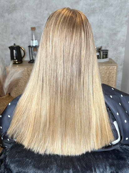 Sleek and straight hair with tape extensions.